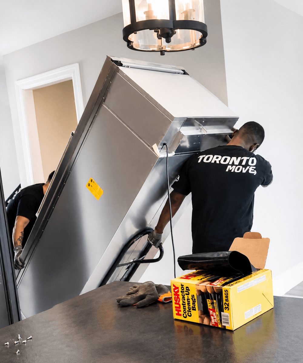 Toronto Move worker carrying furniture